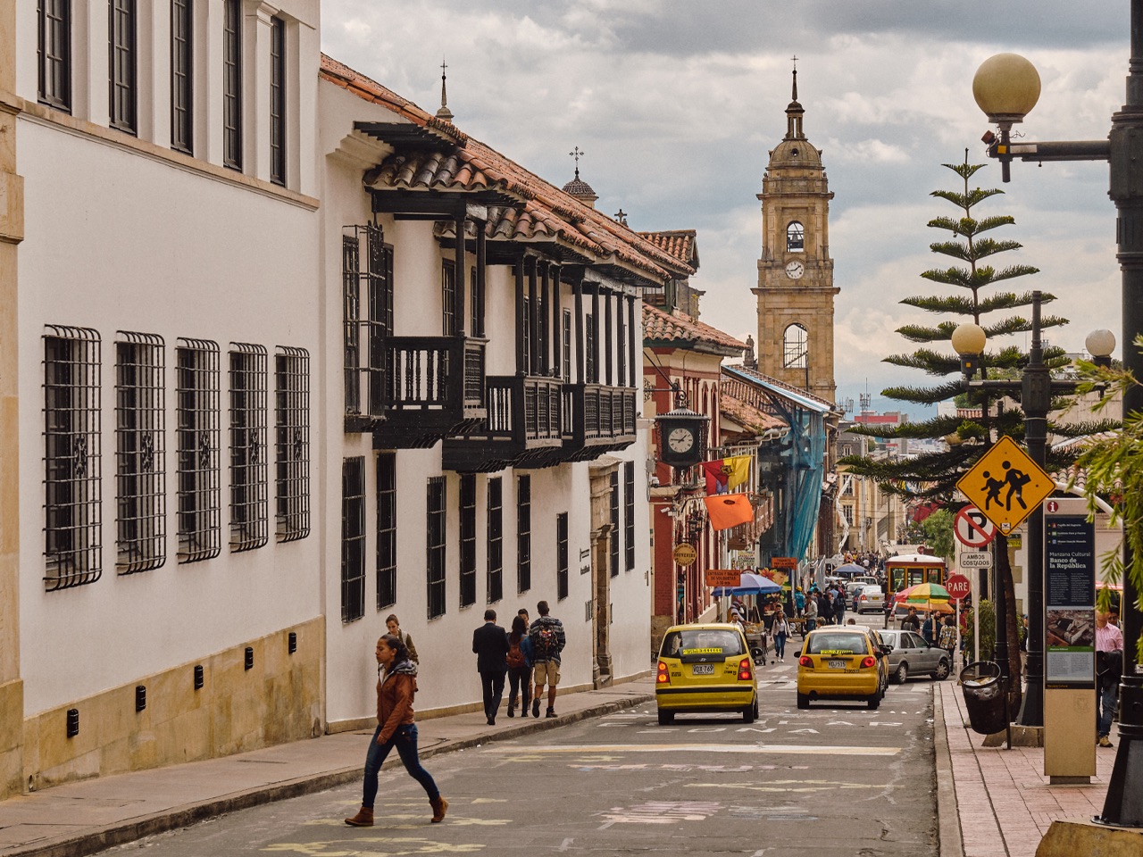 Aerial view of Bogotá's TransMilenio corridor lined with street trees