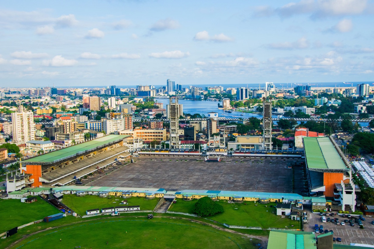 Lagos waterfront with mangrove fringe and informal settlements behind